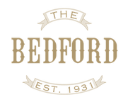 Bedford Logo Pantone 871U.png